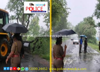 சாலையில் மரத்தை அப்புறப்படுத்தி போக்குவரத்தை  சரிசெய்த காவலர்கள்