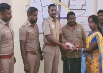 ஓட்டுனரின் நேர்மையை பாராட்டி சால்வை அணிவித்த காவல்துறையினர்